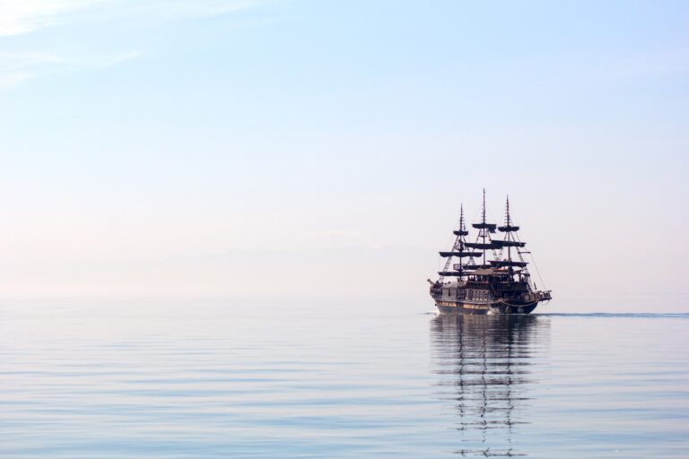 Last Voyage horizontal shot tall ship sailing beautiful clear water daylight
